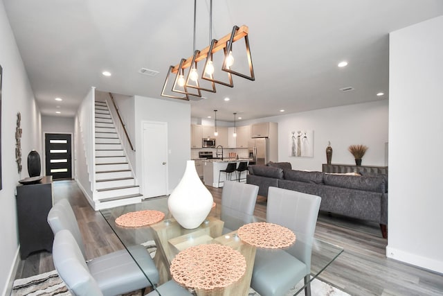 dining space featuring hardwood / wood-style floors