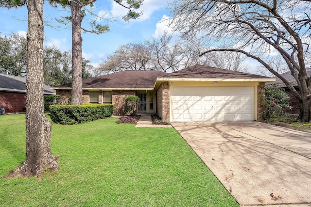 ranch-style house featuring a garage and a front yard