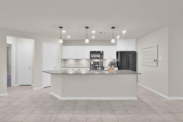 kitchen with a center island with sink, decorative backsplash, white cabinetry, a sink, and black appliances