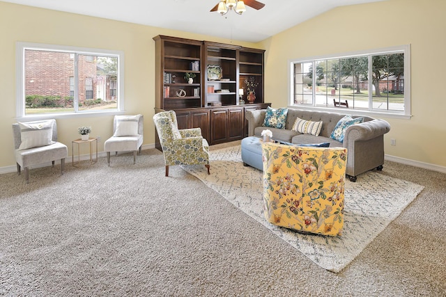 living room with light carpet, vaulted ceiling, and ceiling fan