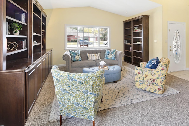 carpeted living room with lofted ceiling