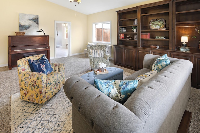 carpeted living room with vaulted ceiling