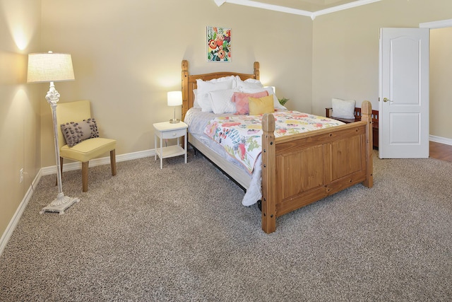 bedroom featuring ornamental molding and carpet