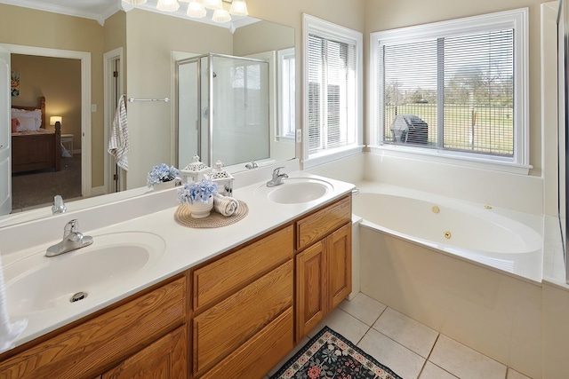 bathroom with tile patterned flooring, vanity, ornamental molding, and plus walk in shower