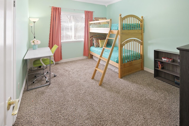 carpeted bedroom featuring crown molding