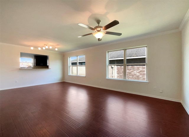 unfurnished living room featuring crown molding, dark wood-type flooring, rail lighting, and ceiling fan