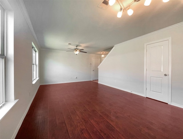 unfurnished room with ornamental molding, ceiling fan, and dark hardwood / wood-style flooring