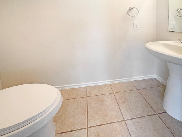 bathroom featuring tile patterned flooring and toilet