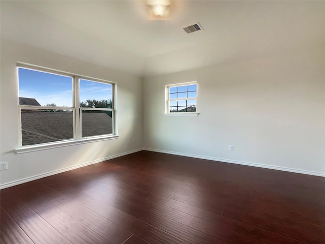 empty room featuring dark hardwood / wood-style floors