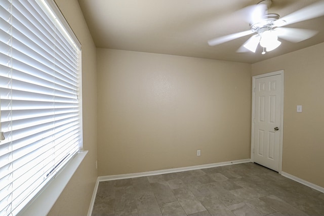 spare room featuring ceiling fan