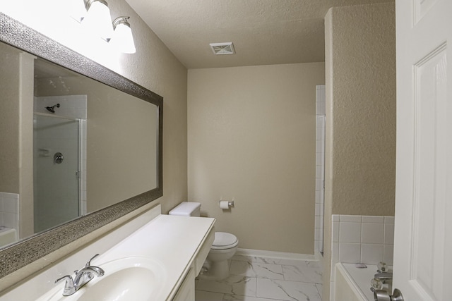 full bathroom with vanity, toilet, plus walk in shower, and a textured ceiling