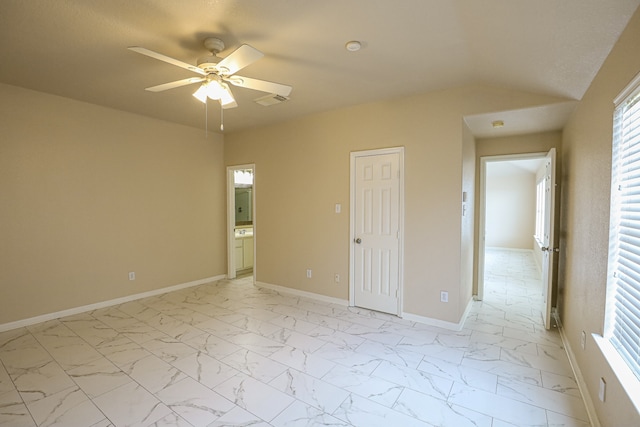 empty room with vaulted ceiling and ceiling fan