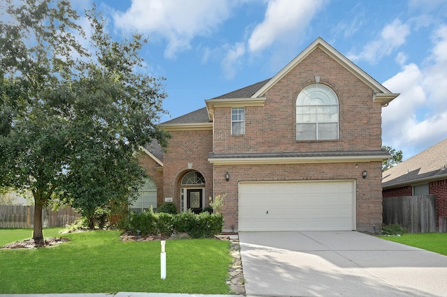 view of front property with a garage and a front lawn