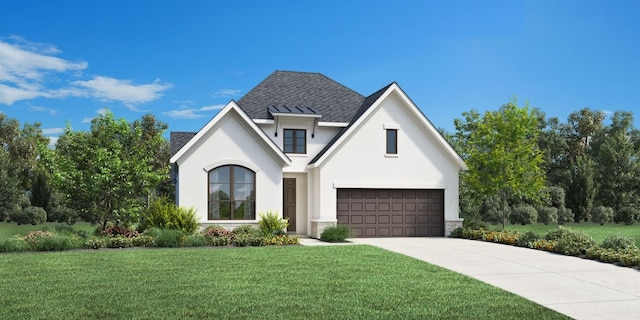 view of front of property featuring a garage and a front yard