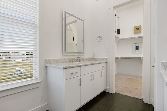 bathroom with vanity and tile patterned floors