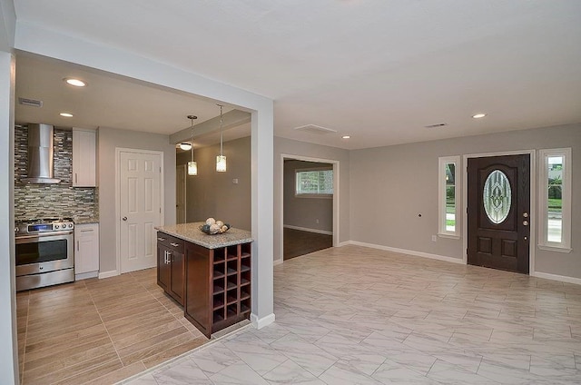 entryway featuring marble finish floor, baseboards, visible vents, and recessed lighting