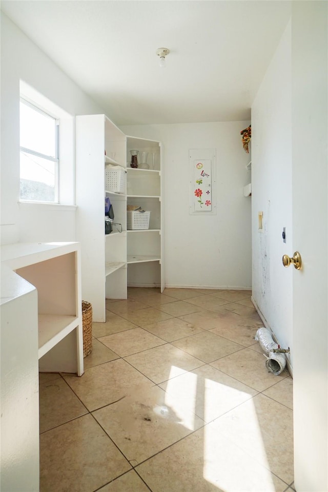 laundry area featuring light tile patterned floors