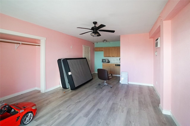 interior space featuring ceiling fan and light wood-type flooring