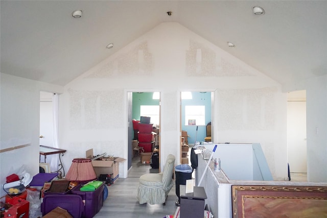 interior space featuring hardwood / wood-style flooring and high vaulted ceiling