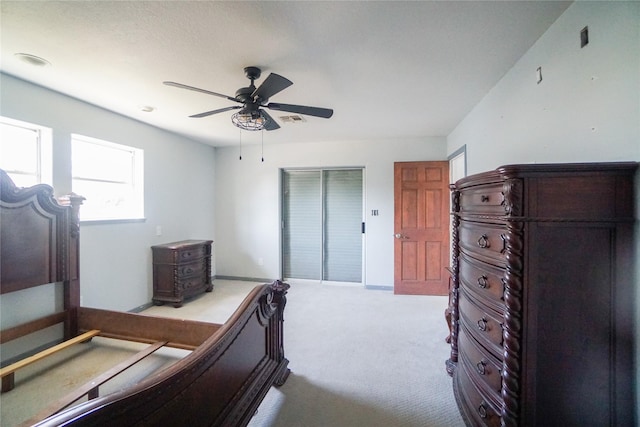 bedroom featuring light carpet and ceiling fan