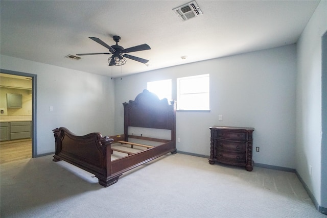 bedroom featuring light colored carpet and ceiling fan