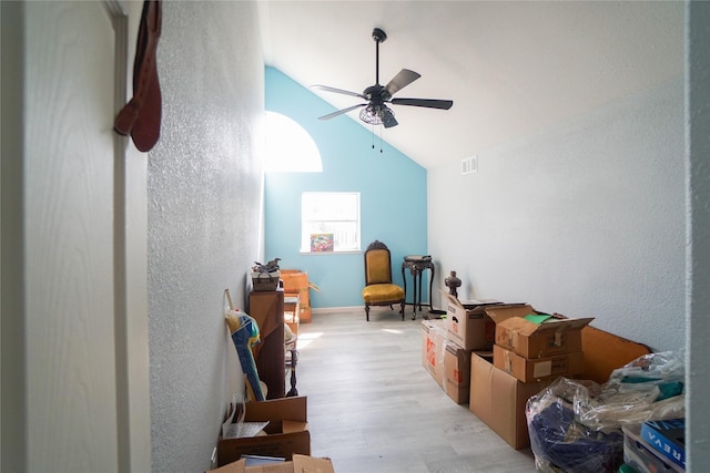 bonus room featuring ceiling fan, high vaulted ceiling, and light hardwood / wood-style flooring