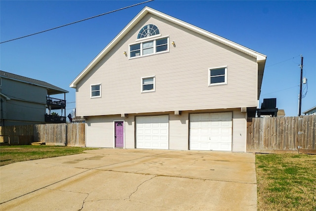 view of side of home with a garage