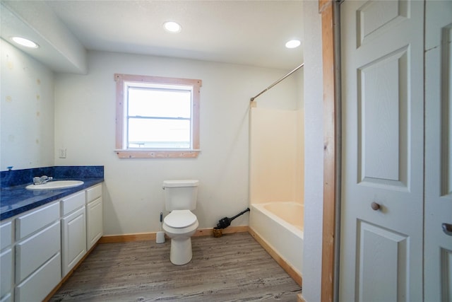 full bathroom featuring vanity, toilet, shower / bath combination, and wood-type flooring