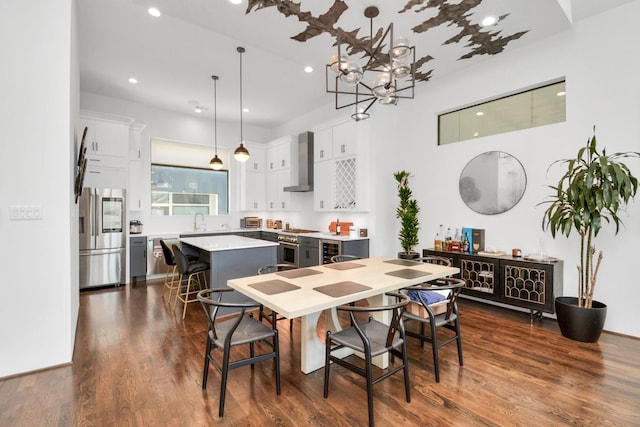 dining room with dark hardwood / wood-style floors and sink