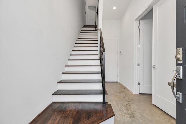 stairs with concrete floors