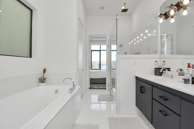 bathroom with vanity, independent shower and bath, and tile patterned flooring