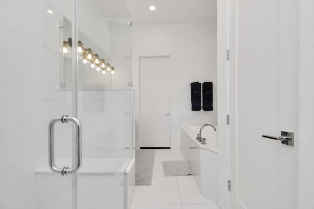 bathroom with tile patterned floors and plus walk in shower