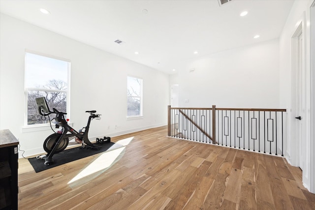 exercise area with light hardwood / wood-style floors