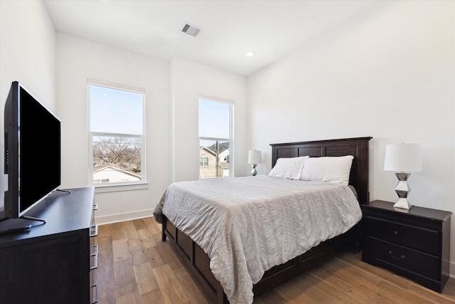 bedroom with light hardwood / wood-style flooring