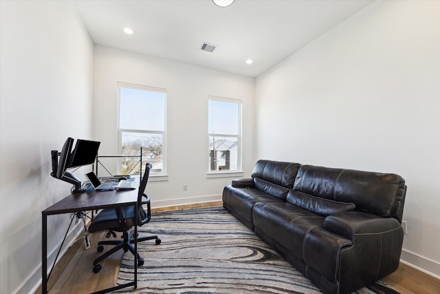 office space with hardwood / wood-style floors