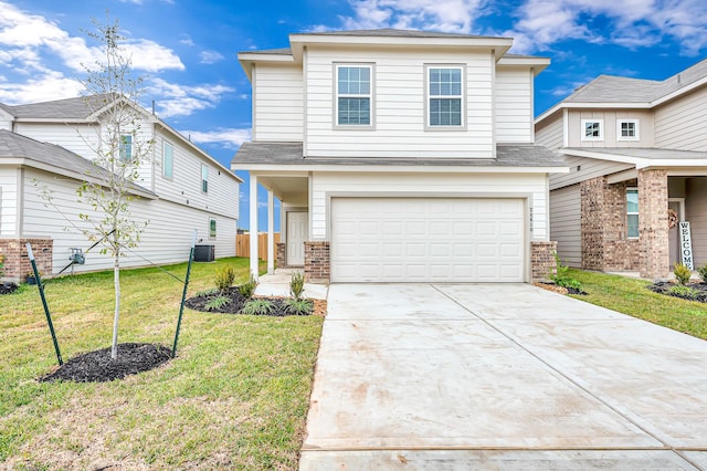 front facade with a garage and a front lawn