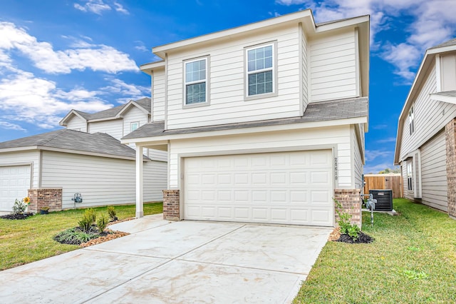 view of front property featuring cooling unit, a garage, and a front lawn