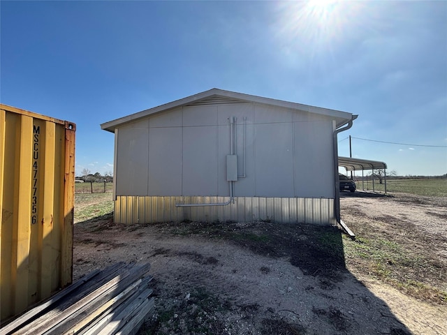 view of property exterior with a carport