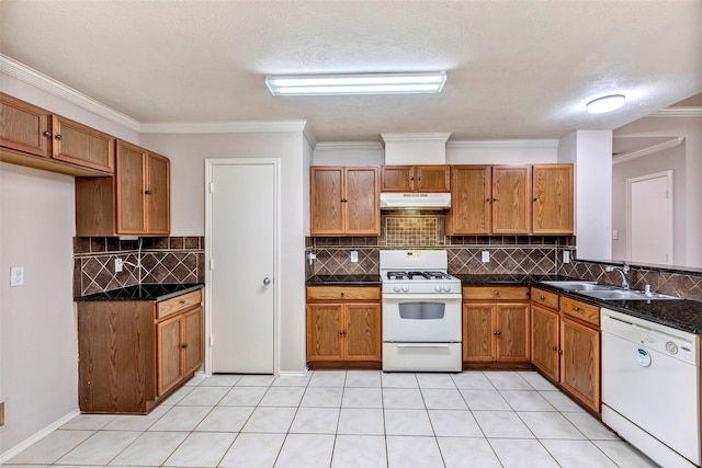 kitchen featuring sink, white appliances, tasteful backsplash, ornamental molding, and a textured ceiling