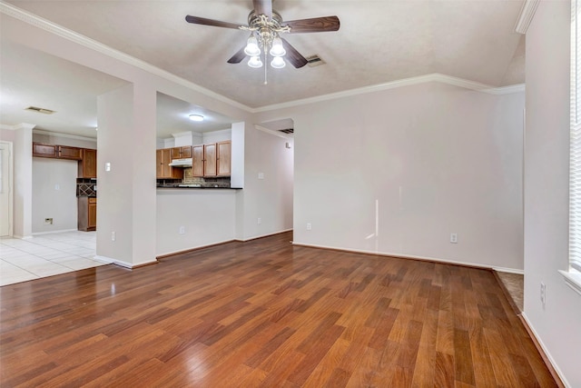 unfurnished living room featuring ornamental molding, light hardwood / wood-style floors, and ceiling fan