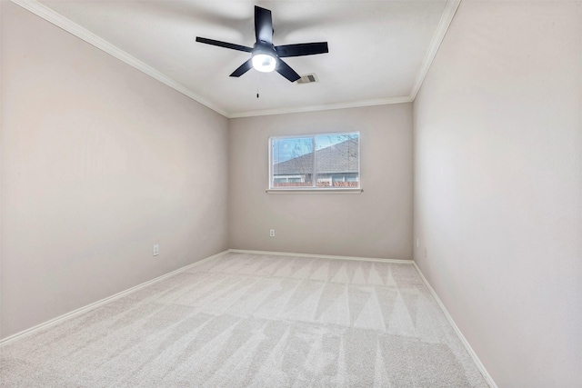 carpeted empty room with crown molding and ceiling fan