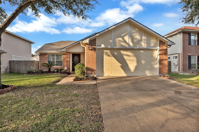 view of front of property with a garage and a front yard