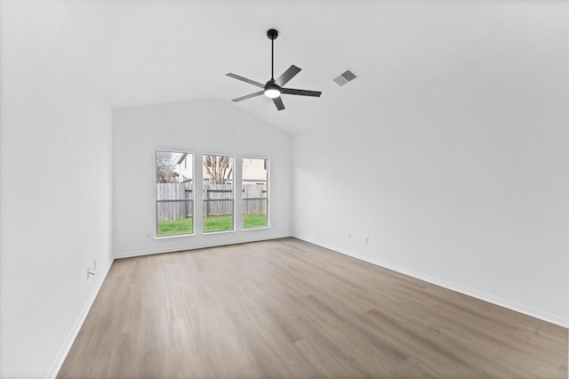 unfurnished room featuring vaulted ceiling, ceiling fan, and light hardwood / wood-style flooring