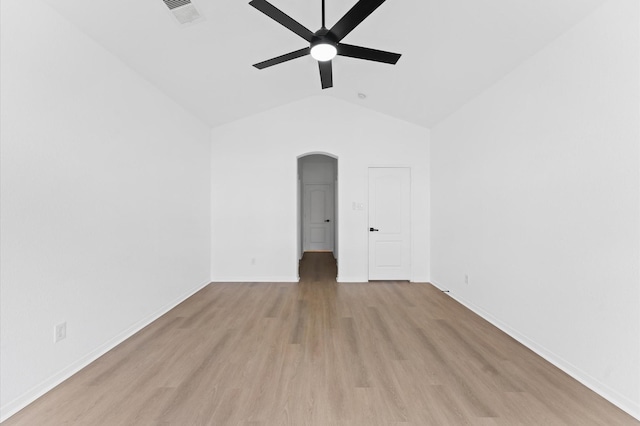 unfurnished room with ceiling fan, vaulted ceiling, and light hardwood / wood-style flooring