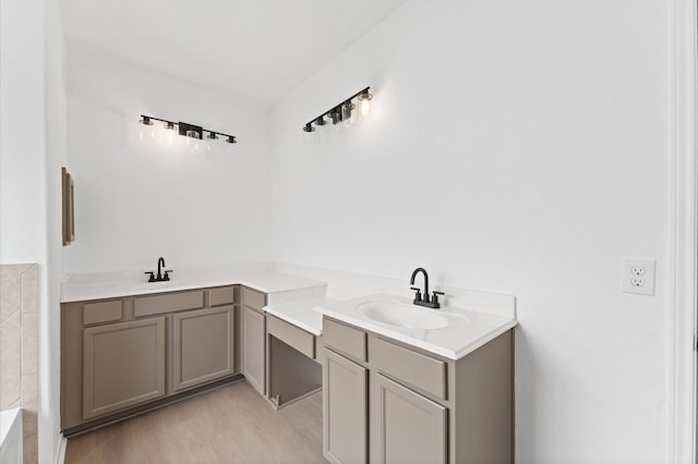 bathroom featuring vanity and hardwood / wood-style floors