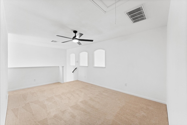 carpeted empty room featuring ceiling fan