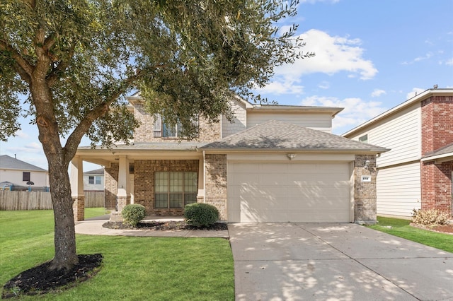 view of front of home featuring a garage and a front yard