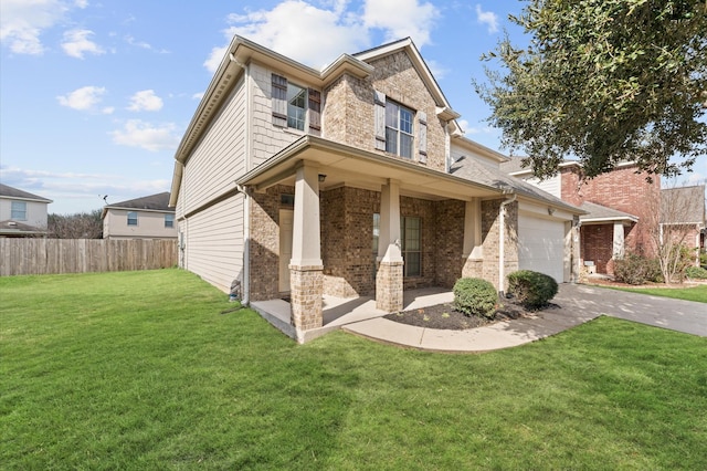 craftsman inspired home with a garage and a front lawn