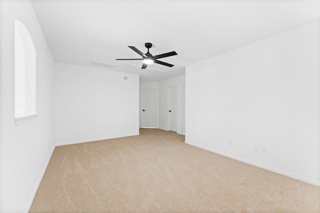 spare room with light carpet and ceiling fan