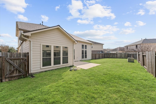 back of property with a patio and a lawn